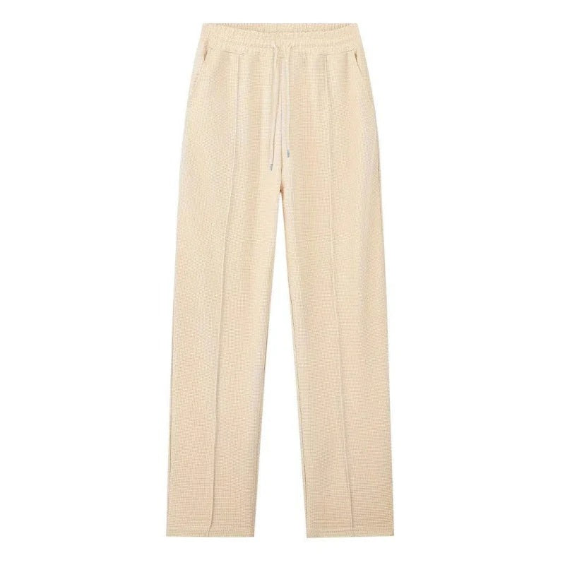 Conjunto para hombre compuesto por sudadera con tejido de punto gofrado y pantalón de pierna recta.